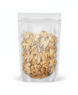 Clear plastic bag filled with walnuts on a white background